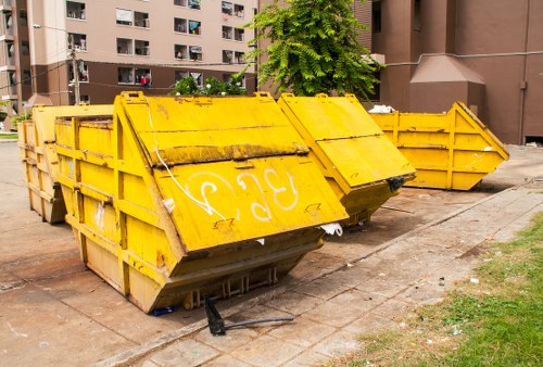 Company vehicle collecting commercial waste at a site entrance